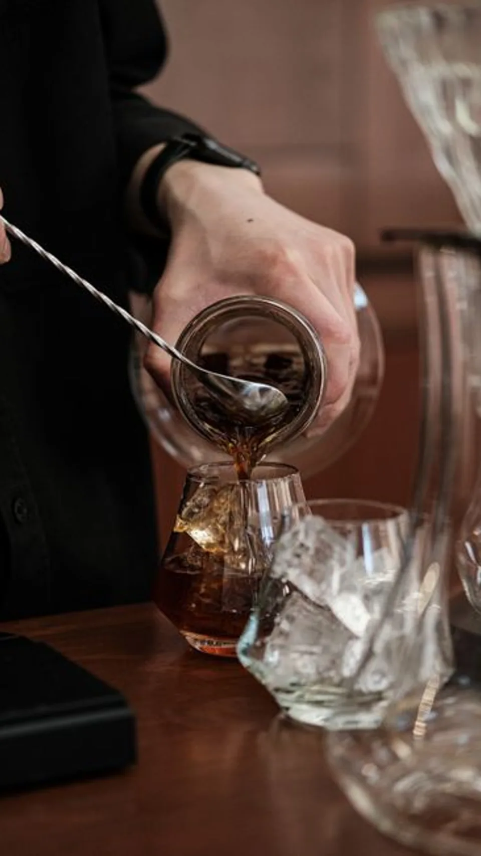 Coffee being poured over ice for a product detail shot