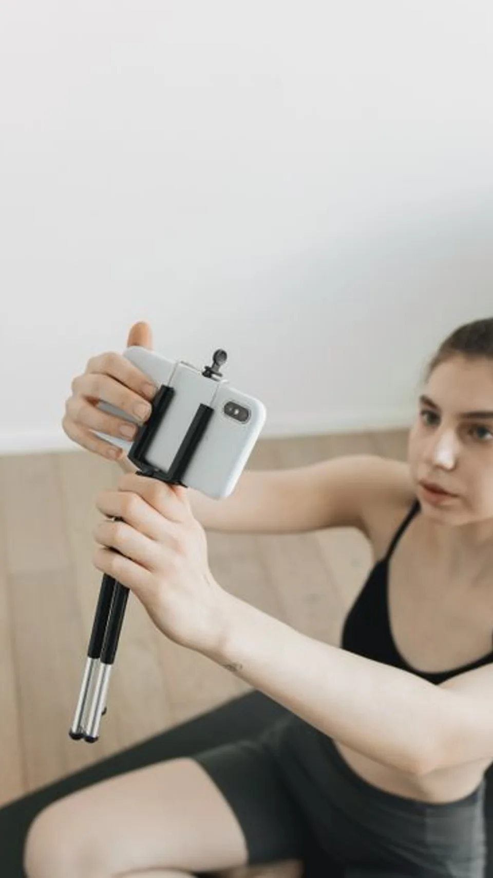 A creator setting up her phone on a tripod